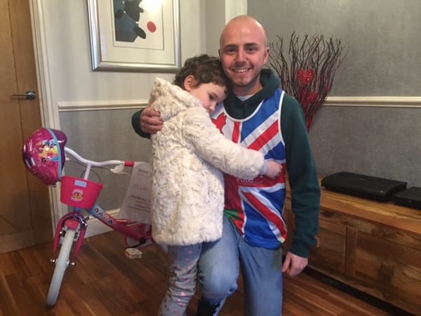 Ellie May receives her new pink princess bicycle